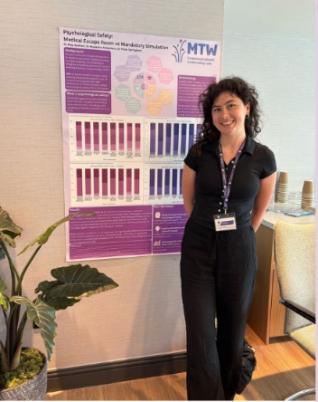 1 person standing by a poster